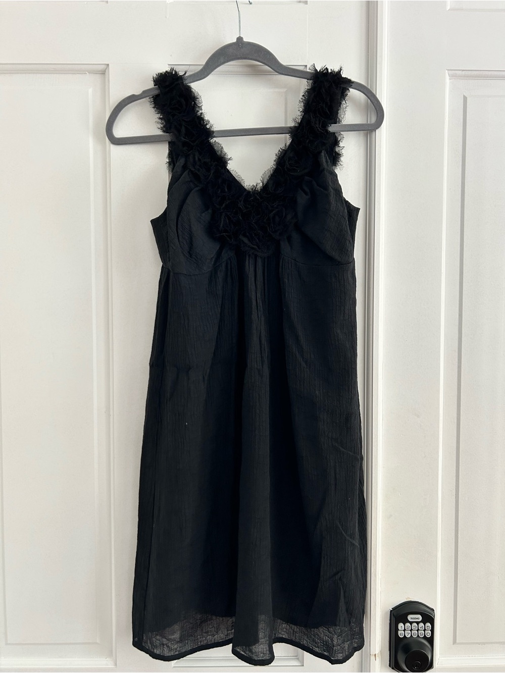 Black Sleeveless V-Neck Dress with Rosette Trim